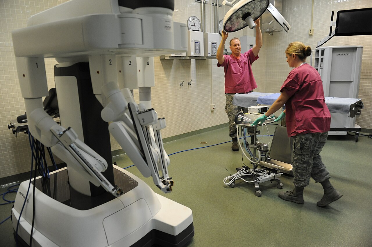 Lt. Col. (Dr.) Thomas Shaak , 81st Medical Support Squadron clinical research laboratory director, and Staff Sgt. Mandy Polen, 81st MDSS clinical research laboratory NCO in charge, prepare a table site for robotic surgical training at the Clinical Research Laboratory Oct. 21, 201