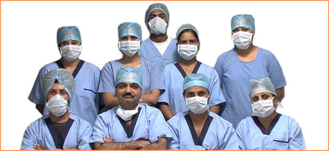 Hair transplant surgeon Dr. Walia (face uncovered) from Ludhiana, India with his clinical team